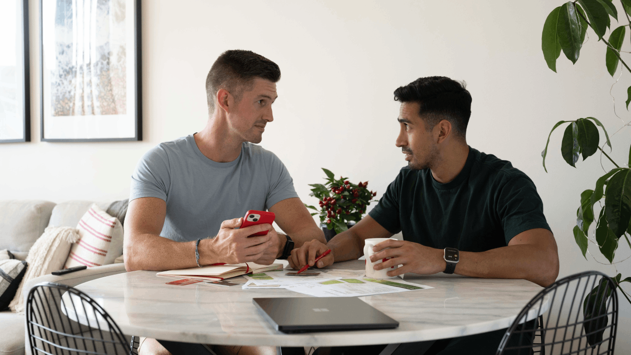 two men talking about the rising interest rates in Australia